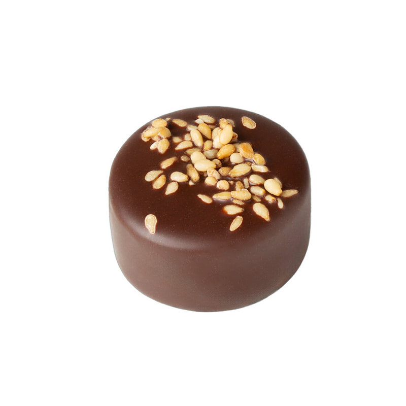 LAYERED MARZIPAN Pure marzipan layered with dark chocolate topped with caramelized sesame seeds. Vegan. Gluten-free